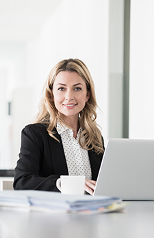 Woman takes online paralegal classes on her laptop